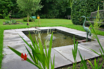 Garden pond with paved surround